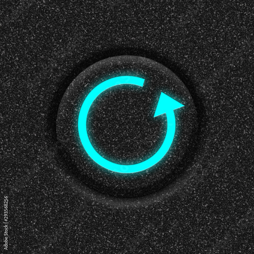 Fotografie Closeup of dark reset switch with blue led symbol