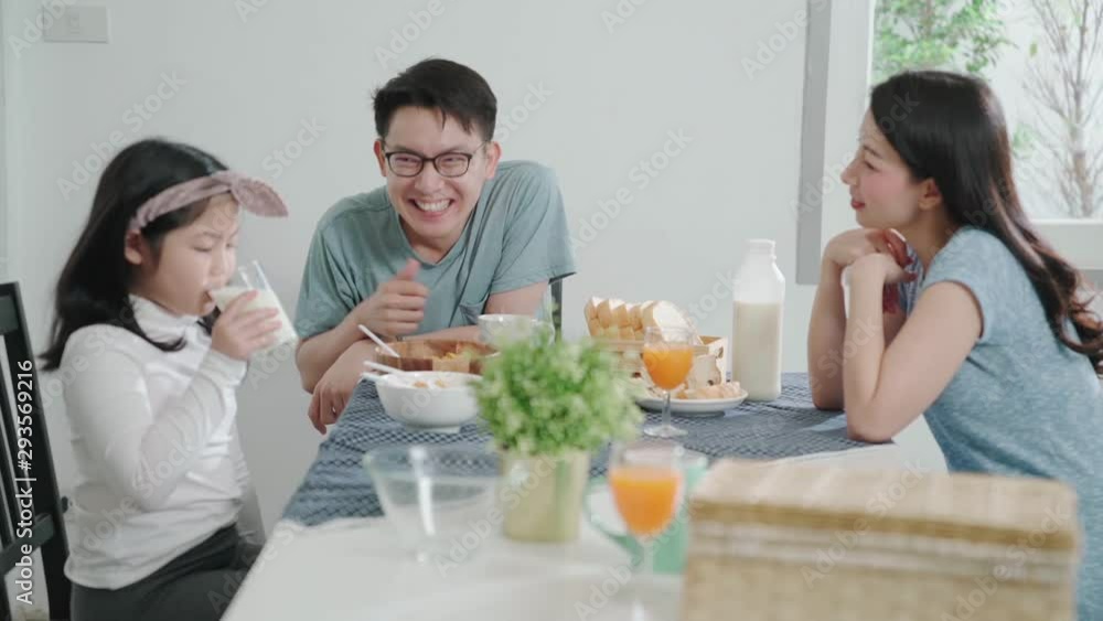 happiness asian family dad mom and daughter enjoy breakfast together on dining table wonderful moment family concept happiness asian family dad mom and daughter enjoy breakfast together on dining table wonderful moment family concept