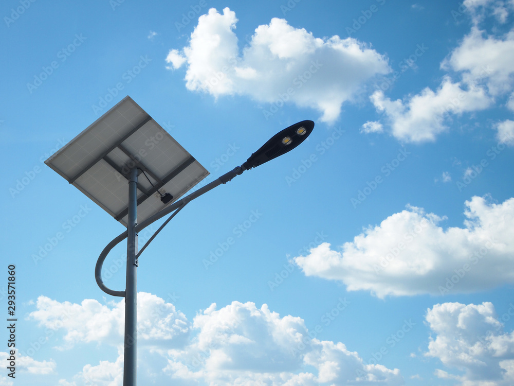 solar street light lamp post led with panel system and blue sky and white clouds using for background energy saving concept.