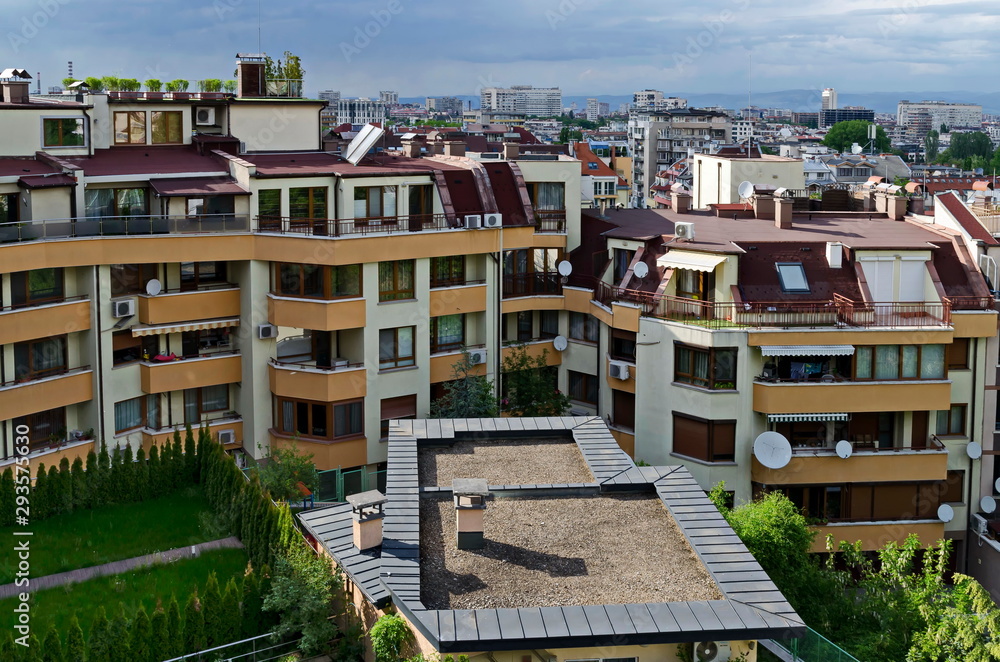 Residential neighborhood with new modern houses against the backdrop of a cityscape in the Bulgarian capital Sofia, Bulgaria  