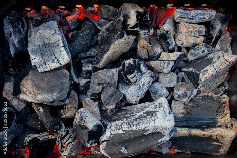 Fototapeta premium Black hot coals for grilled meat.