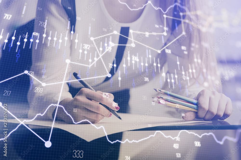 Double exposure of hands making notes with forex chart huds. Stock market concept. Double exposure of hands making notes with forex chart huds. Stock market concept.