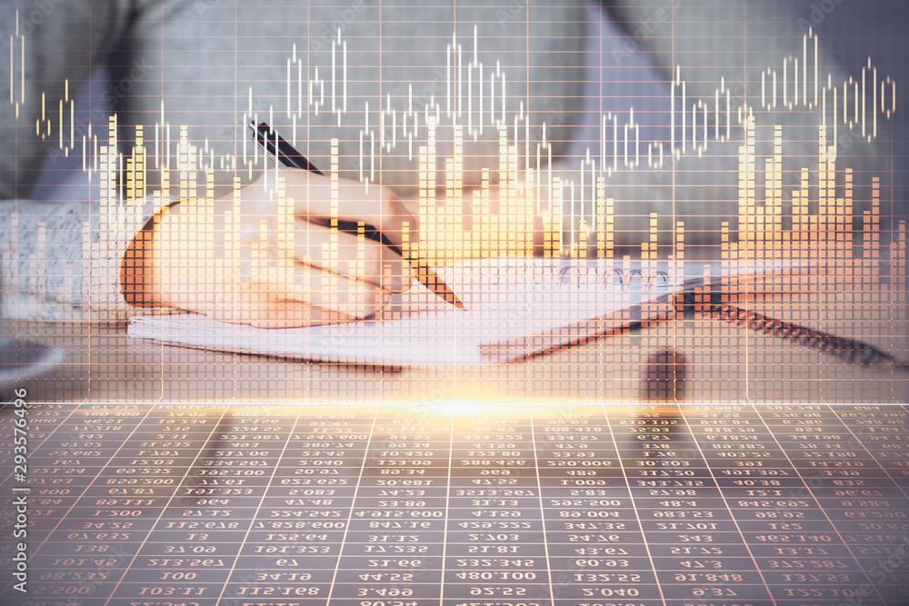 Hands writing information about stock market in notepad. Forex chart holograms in front. Concept of research. Multi exposure Hands writing information about stock market in notepad. Forex chart holograms in front. Concept of research. Multi exposure