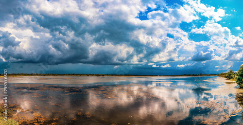 Fototapeta Naklejka Na Ścianę i Meble -  blue sky with clouds reflected in water