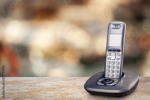 Canvas Print Cordless phone with cradle on white background