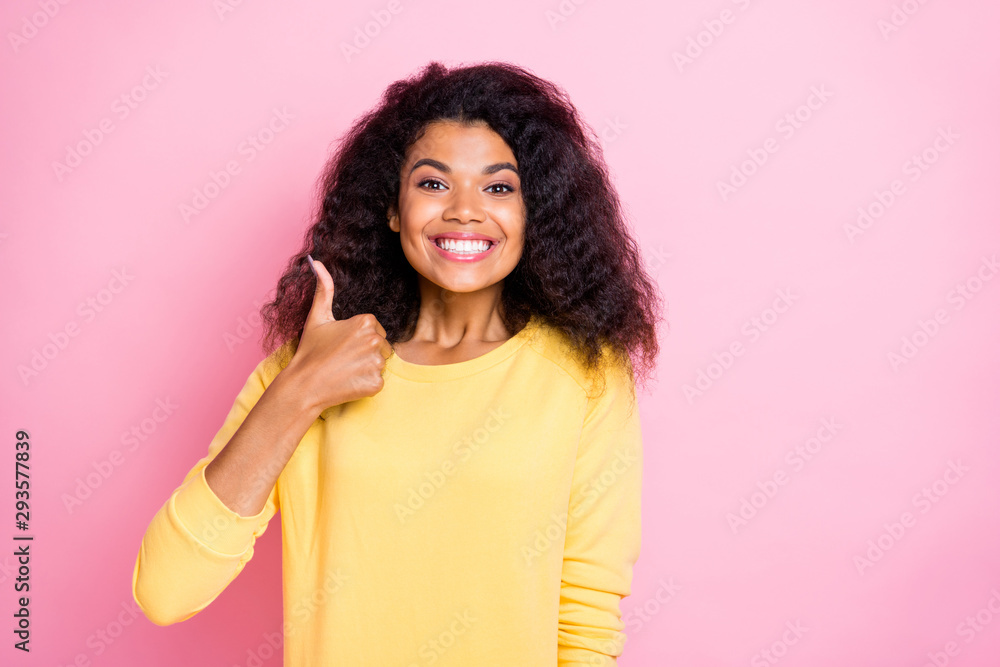 Portrait of positive cheerful african girl show thumb up recommend adverts choose choice decide decision wear good look isolated over pink color background Portrait of positive cheerful african girl show thumb up recommend adverts choose choice decide decision wear good look isolated over pink color background