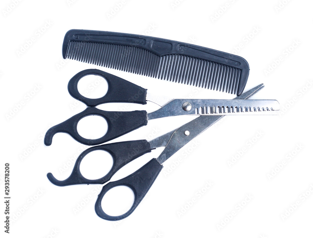 Comb with scissors on a white background Comb with scissors on a white background