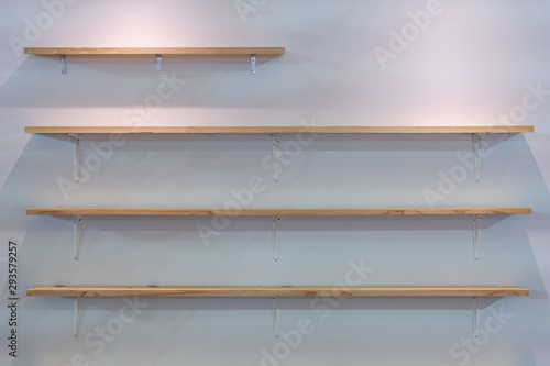 Wooden wall shelf or shelves for display product on white wall panel background interior decoration