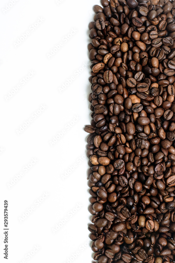 Fototapeta premium coffee beans on white background.vertical photo space for text. photon image