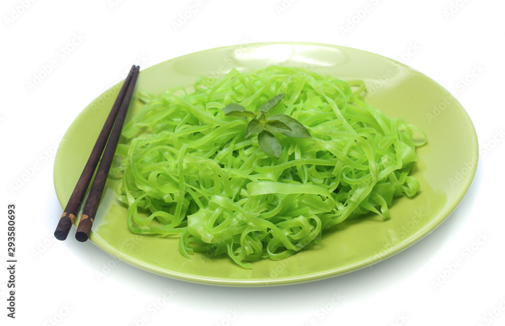 green noodles on dish isolated on white background green noodles on dish isolated on white background
