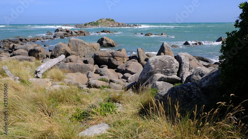 Seashore and Rocks at Cozy Nook Bay, Southland, New Zealand photo