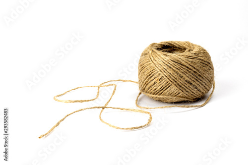 Skein of jute twine threads isolated on white background. Natural fiber for work and creativity.