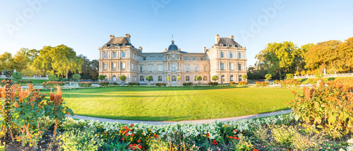 Panorama of Luxembourg garden with statues, flowers and building of Luxembourg Palace. Paris, France