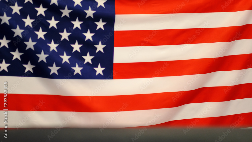 Naklejka premium United States of America waving flag. background