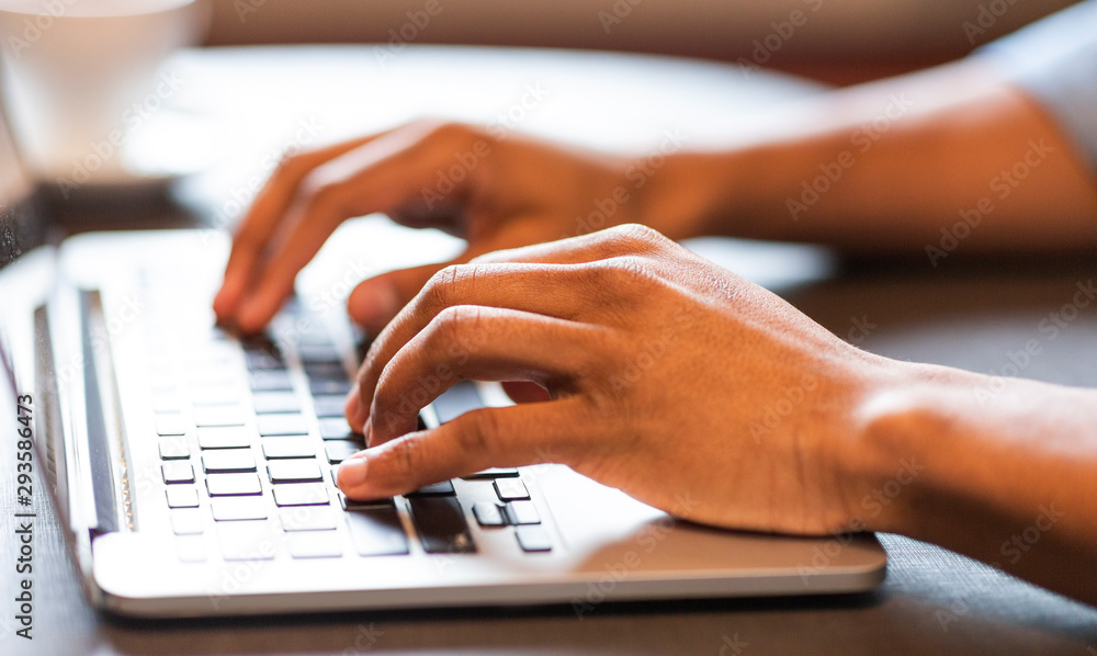 Male hands typing text or programming code on laptop Male hands typing text or programming code on laptop
