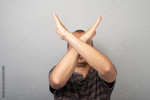 Oh no! Close up studio photo portrait of sad upset unsatisfied handsome marketer financier economist him he crossing two hands looking at camera wearing classic outfit isolated grey background photo