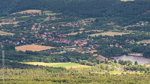 Wallpaper Mural 4K Time Lapse view of Top view Shadows from Clouds moving on the forest, village with lake and fields. Timelapse of shadows from clouds moving on ravine and hill. Torontodigital.ca
