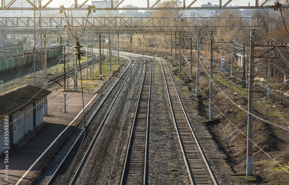 railways. two track rails leaving the distance and station railways. two track rails leaving the distance and station