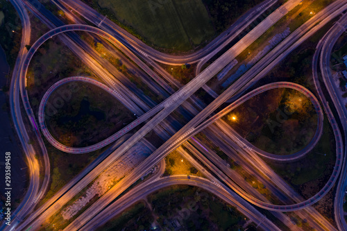 aerial view ring road and interchange connecting the city at night