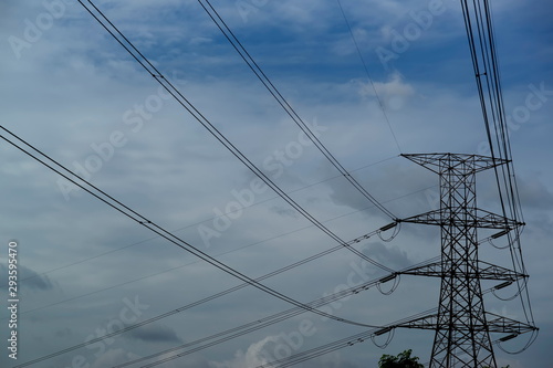 Electricity high voltage pole and blue sky background.