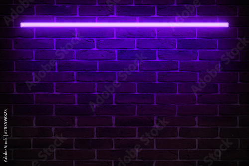 Background texture of empty red brick wall with violet neon light lamp, 80s style glow photo