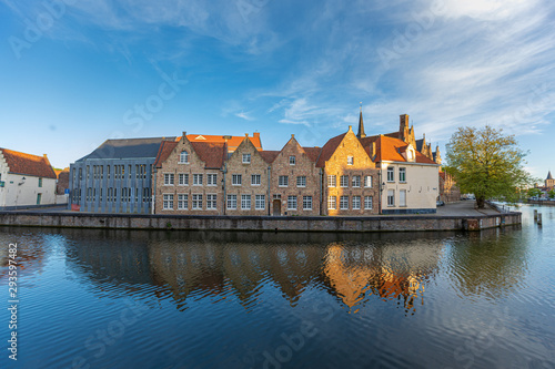 Colored romantic houses by the canal in the historic city center of Brugge