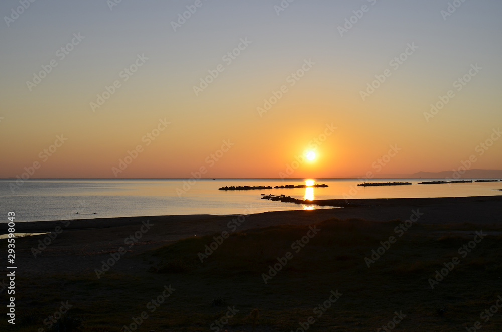 Sunrise with sun on the Adriatic Sea Italy