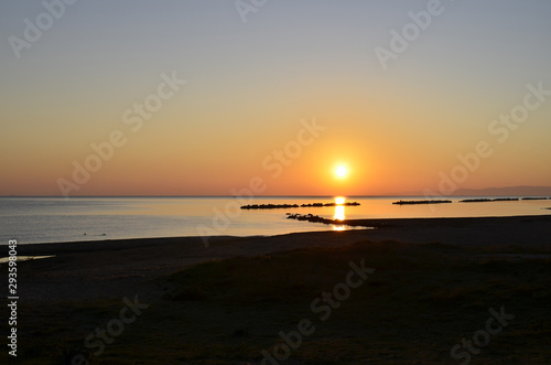 Sunrise with sun on the Adriatic Sea Italy