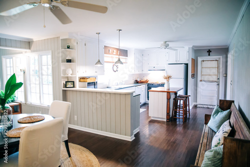 Small eat-in kitchen dining room with a small table for four and upholstered chairs