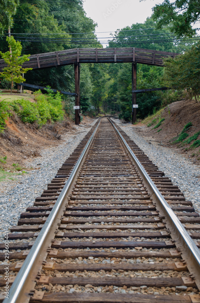 Fototapeta premium Wooden bridge over railroad tracks.