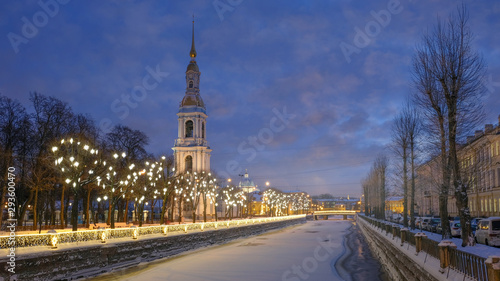 The bell tower of the Naval Cathedral of St. Nicholas on winter evenings with Christmas and New Year lights in St. Petersburg Russia