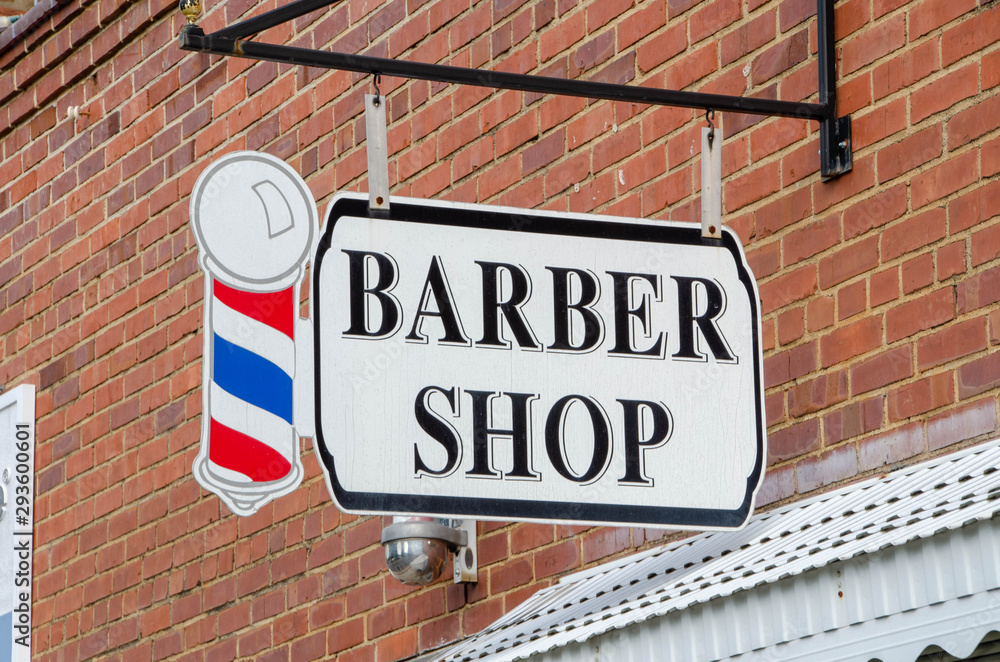 Obraz premium Closeup of a Barber shop sign with Barber Pole