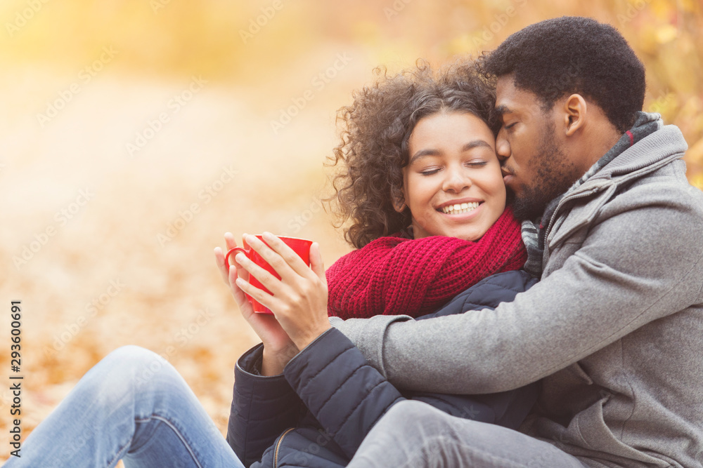 Tender moments. Romantic couple drinking coffee in park Tender moments. Romantic couple drinking coffee in park