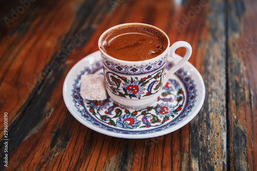 A cup of Turkish coffee on a wooden table