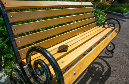 A mobile phone incidentally left on a bench in a park. Concept of loss of valuable property, access to private information.