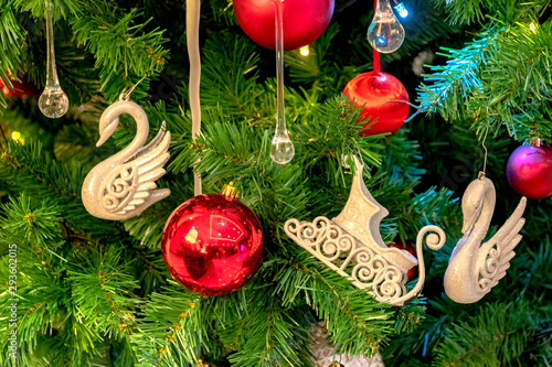 Christmas decorations on the branches of a festive spruce