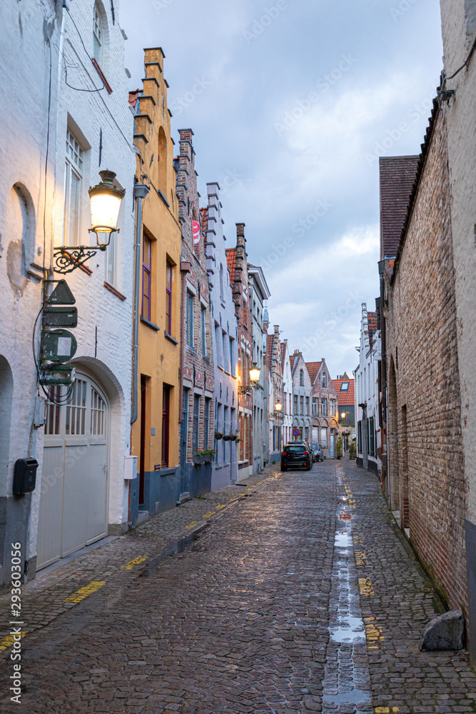 Streets in the old town of Bruges in the evening. Street light.