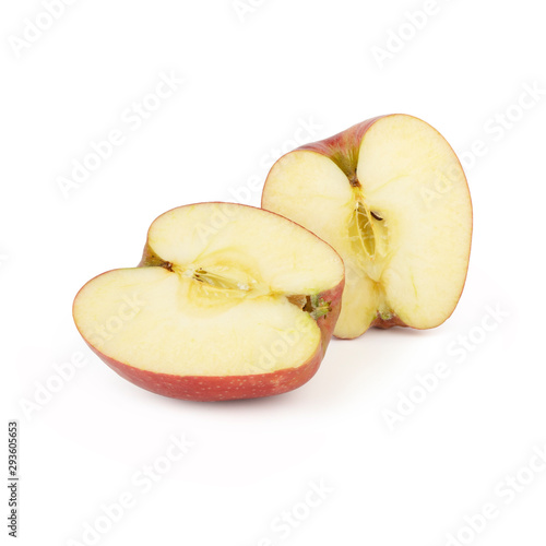 Fresh big red apple cut in half into identical pieces isolated on a white background. Side view.