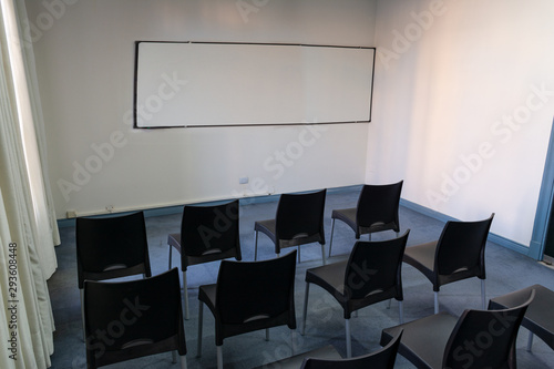 classroom with chairs and blackboard photo