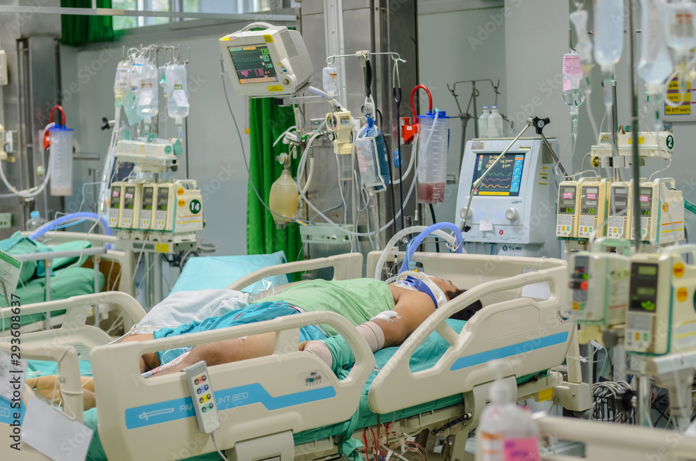 Patient with  life saving equipment for treatment in ICU at the hospital. - obrazy, fototapety, plakaty 