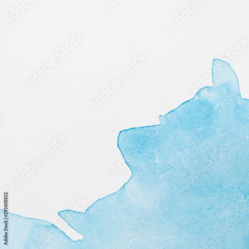 Waterly blue hand painted stain on white surface photo