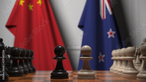 Flags of China and New Zealand behind pawns on the chessboard. Chess game or political rivalry related 3D animation photo