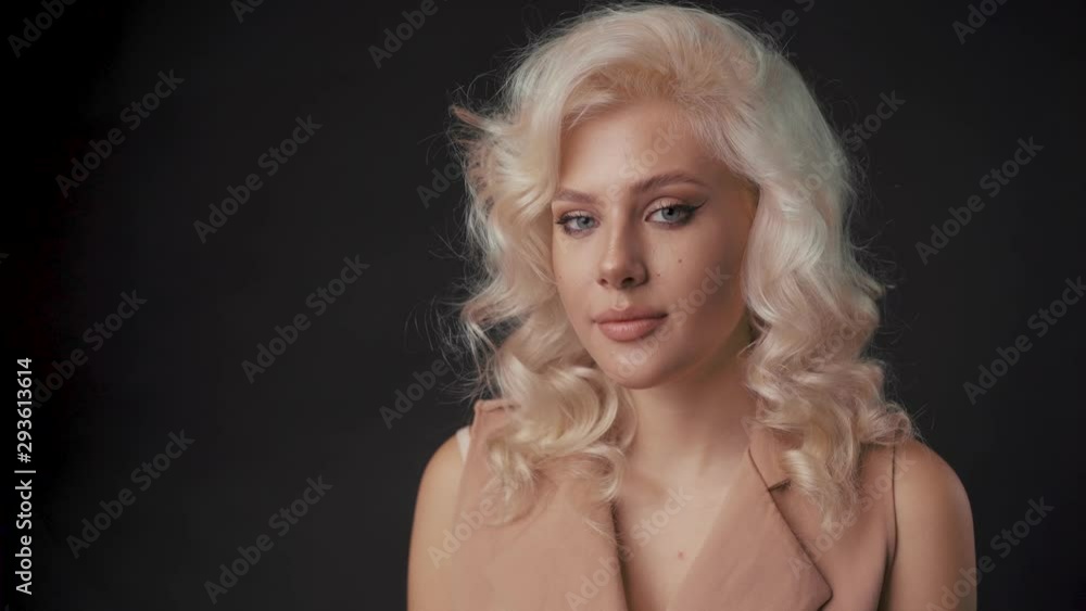 Happy young woman look at camera, in studio. She is happy Happy young woman look at camera, in studio. She is happy