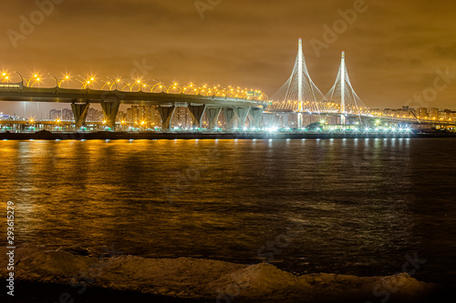 St. Petersburg Neva river morning day evening night sunset dawn during winter summer spring autumn cable-stayed bridge Zenit Arena Lakhta center reflection in water, glows and lights photo