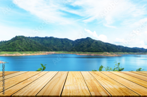 Perspective of wooden with blurred of beach background