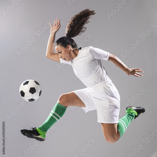 Woman in sportswear playing football