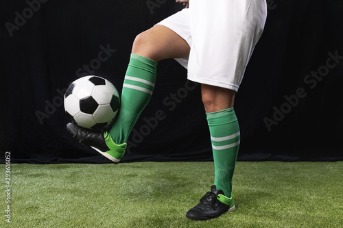 Fototapeta Naklejka Na Ścianę i Meble -  Football in sportswear with ball
