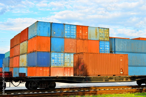 Cargo dock terminal with sea containers. logistic warehouse port of shipping container for the subsequent sorting, loading and sending them on freight railway cars or trucks to the client - Image photo