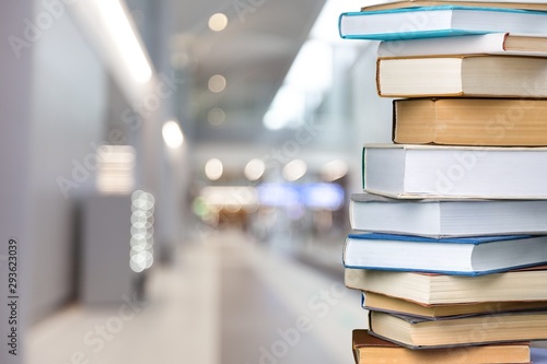 Books collection in pile on background.