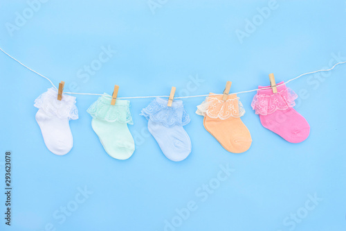Baby socks on blue background.